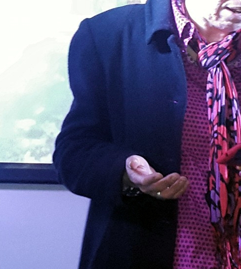 Hand of poet Jackson reading live