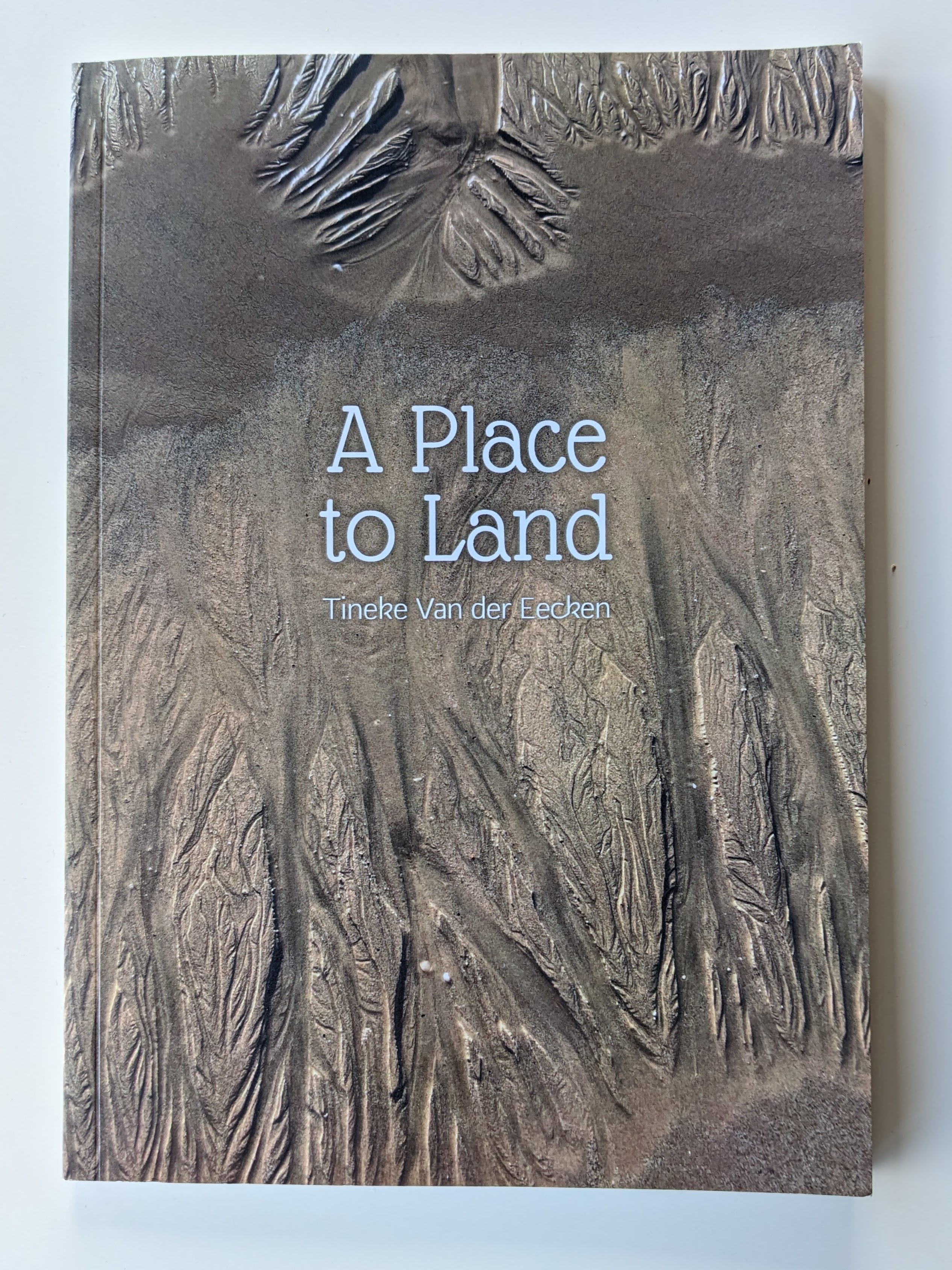 Poetry book edited by Jackson: "A Place to Land" by Tineke Van der Eecken